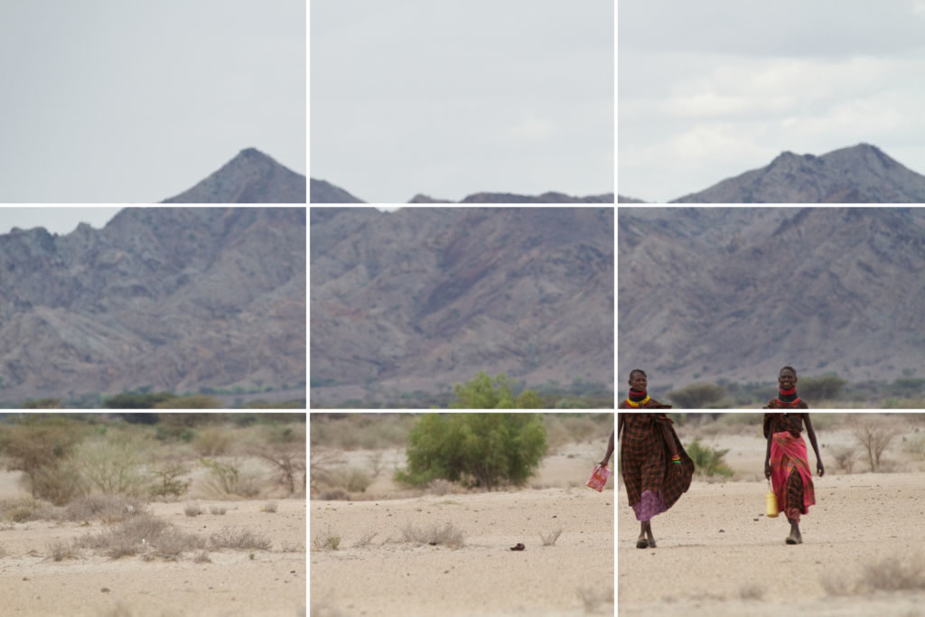 Woman walking in arid landscape